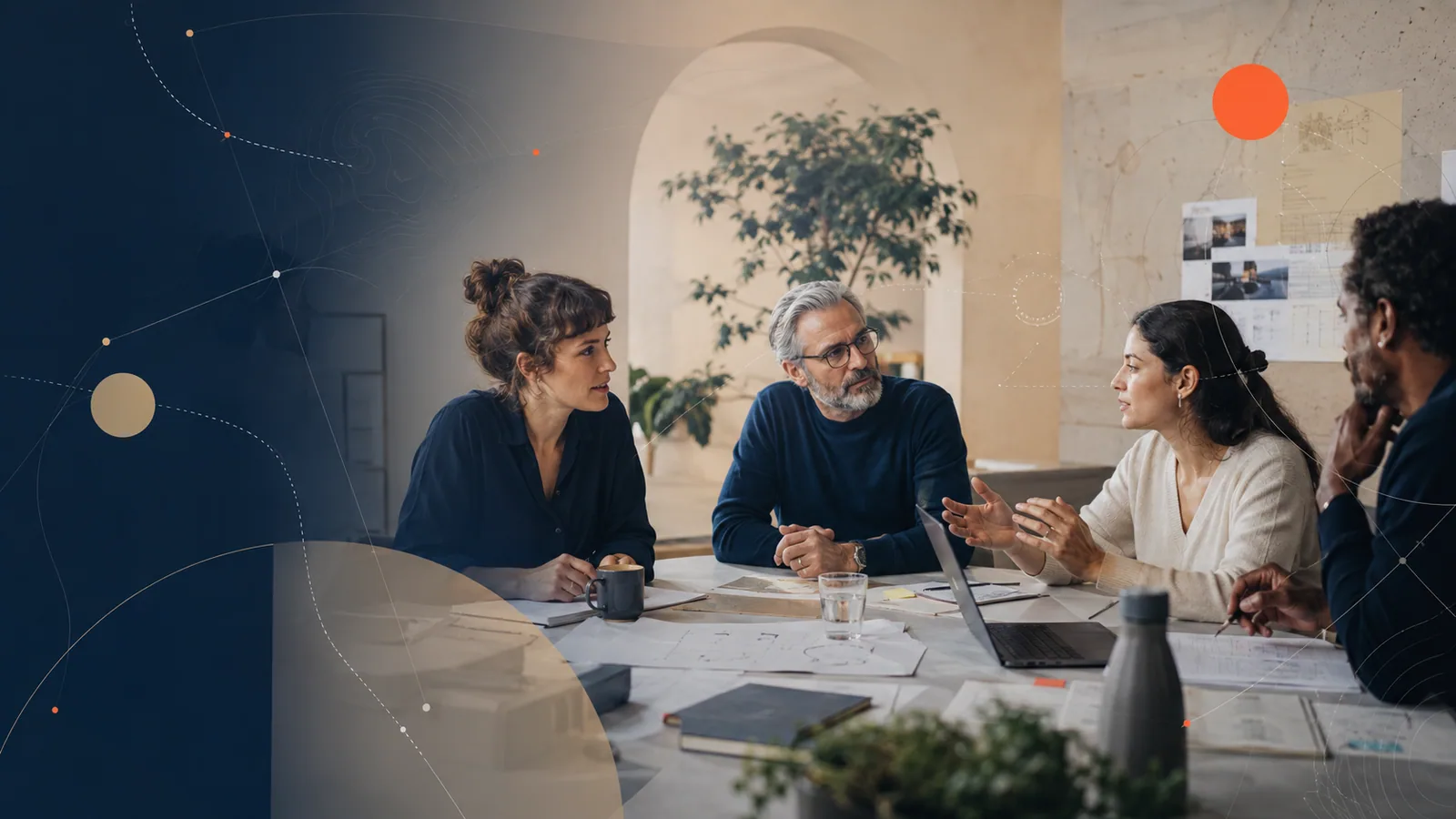 A team discussing ideas around a shared work table