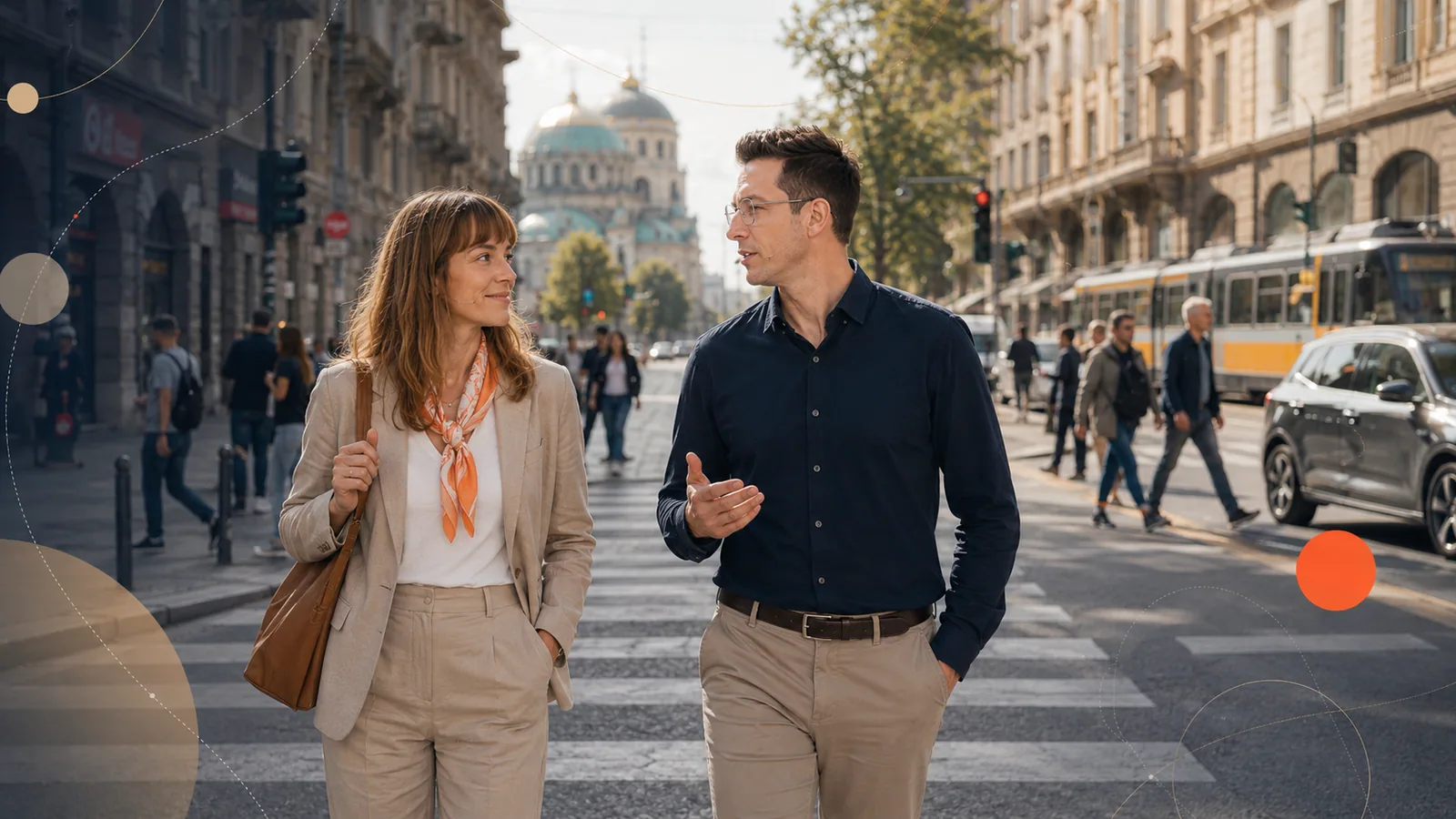 Two people talking on a city street